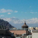 roof top view (with mountains in background) from my first apartment in the city