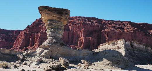 Ischigualasto: El Hongo (the mushroom) in front of the amazing tall red cliffs