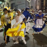 Carnival in Montevideo: two eldery couples (Mama Vieja & Gramillero) dancing