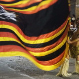Carnival in Montevideo: a flag bearer in jungle costume.