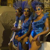 Carnival in Montevideo: three dancers waiting in the staging area