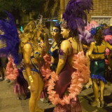 Carnival in Montevideo: three performers waiting in the staging area