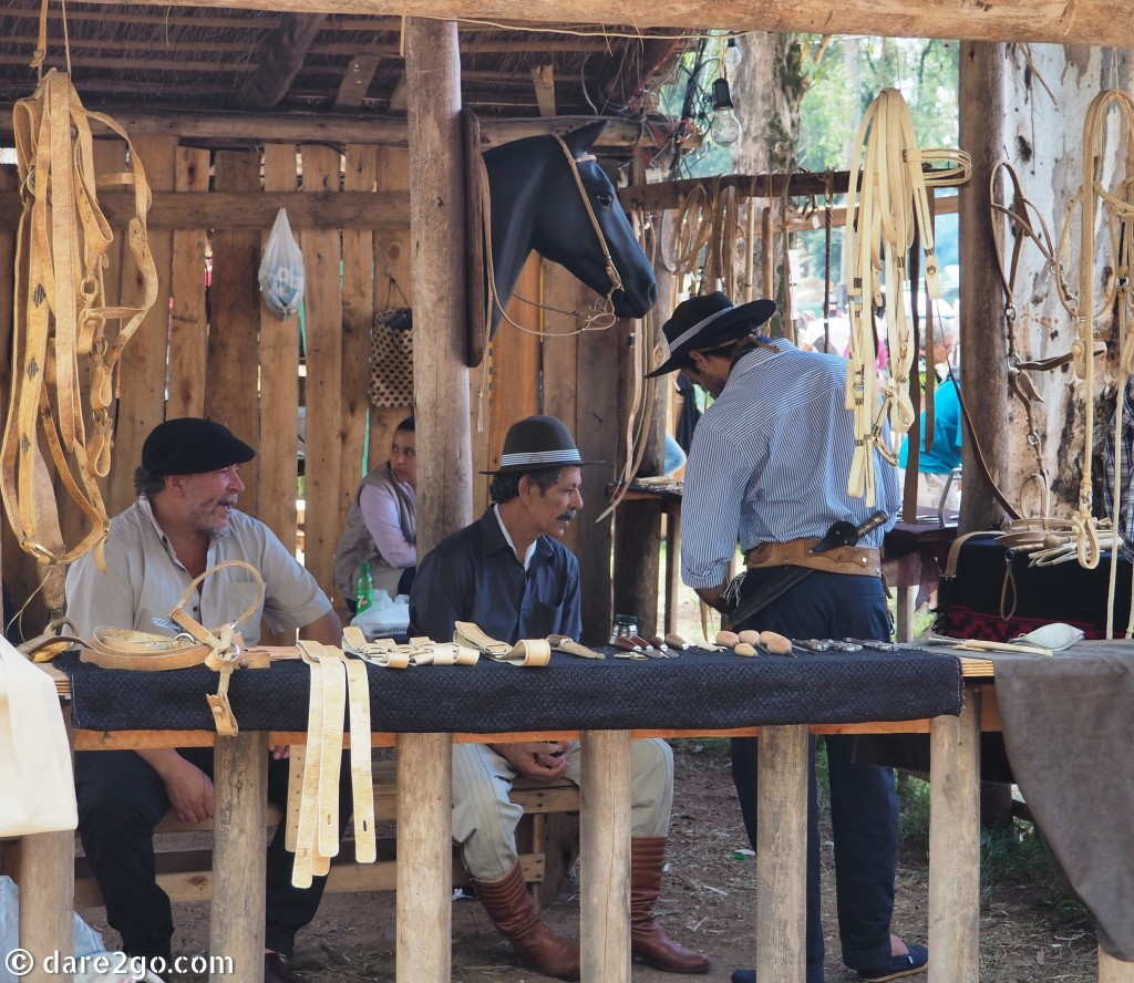 Calendar - June: traders at one of the Guasquero stalls. Guasqueros (a very Uruguayan word) make bridals and ropes for horses from cured cow or sheep hides.