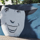 Stylised man's face on a blue wall. Another mural in Pan de Azucar.