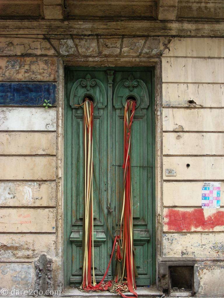 We photographed this old door in Ciudad Vieja, the old city of Montevideo. This part of town is bustling with tourists in the daytime, since most cruise ship visitors come here, but not quite safe at night.