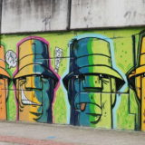 The twelfth (and last) section of the overpass wall. Here it gets rather low - these faces just fit.