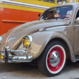 A beautifully kept old Volkswagen Beetle in beige.
