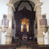 Inside the Igreja de São Pedro dos Clérigos in Mariana. Beautiful dark wood carvings – without the normal cover of gold leaf (because the church was never finished).