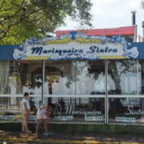 A fish restaurant in São Antonio de Lisboa: the strip with its name is tiled in 2 colours, the border around the name picks up the design features of hand-painted Portuguese tiles, but is made from plastic.