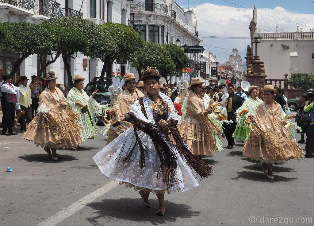 The women in the procession were dressed in the typical flared long skirts with frilly underskirts.