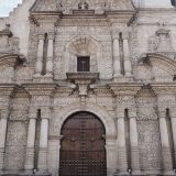 The elaborate facade of the church of La Compañía de Jesús, Arequipa. Compared to this, the interior is rather plain. This church, diagonally opposite the cathedral, was originally built by Jesuits. Don't miss visiting the adjoining monastery - now home to many galleries and shops selling alpaca products!