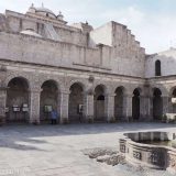 The first courtyard of the monastery of La Compañía de Jesús in Arequipa has absolutely intricately carved columns made from the white sillar stone. It's easy to miss the entrance to this: it's to the left of the church, between the shops!