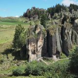The rocky outcrops of Cumbe Mayo are interspersed with farmland grazing sheep.