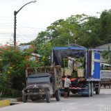 Instead of being shipped in cardboard boxes, these bananas were densely stacked by hand - row by row - onto the back of the truck.