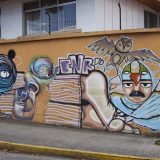 Street art in Cuenca, Ecuador: part of a long wall.