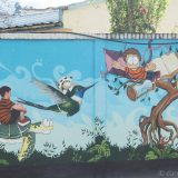 Street art in Loja, Ecuador: we loved some of the humourous pieces on the colourful school wall.