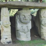 San Agustín Archaeological site: several carved figures support a large stone sheet - usually a corridor to a grave.