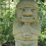 This figure in the forest of statues is playing a musical instrument. See the yellow mark on his forehead - it's a brightly coloured caterpillar.