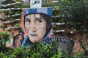 If you have some energy left after the tour of Comuna 13, head down the street to the cemetery. Its outside wall is amazing! Just follow the route the bus would take back to the Metro station.