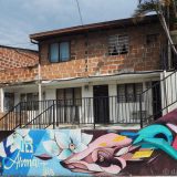 'Desarma Tus' - Disarm you(rself) - a clear message, right at the entrance of Comuna 13.