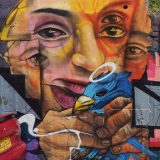 Please, can you interpret this street art! It's part of the retaining wall at the community entrance.