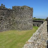 World Heritage Listed castles in Wales: a view along the outer wall of the Beaumaris fortifications.