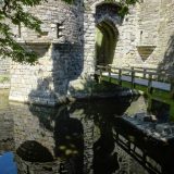 World Heritage Listed castles in Wales: the entrance gate of Beaumaris reflected in the moat.