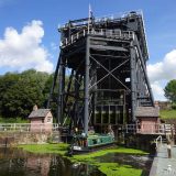 The Anderton Boat Lift: a short(-ish) narrowboat leaving the right-hand caisson.