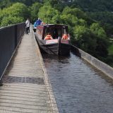 Two narrowboats crossing the Pontcysyllte Aqueduct in Wales.