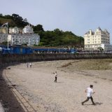 Llandudno: visitors come for the beach, but the pier in the background is also a draw, with all types of amusements and sweet treats available there.