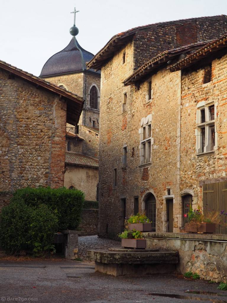 Pérouges' streets, with the town's church in the background.
