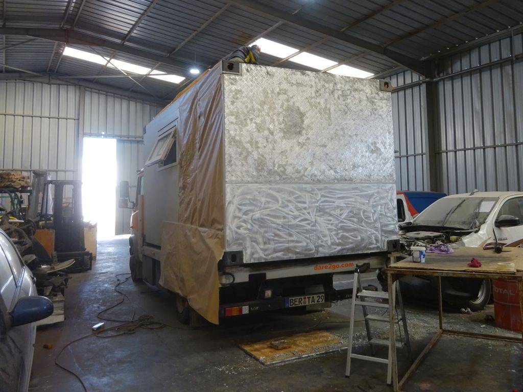 4th day in the workshop: the aluminium sheets are prepared and Bertita is being masked ready for the paint.