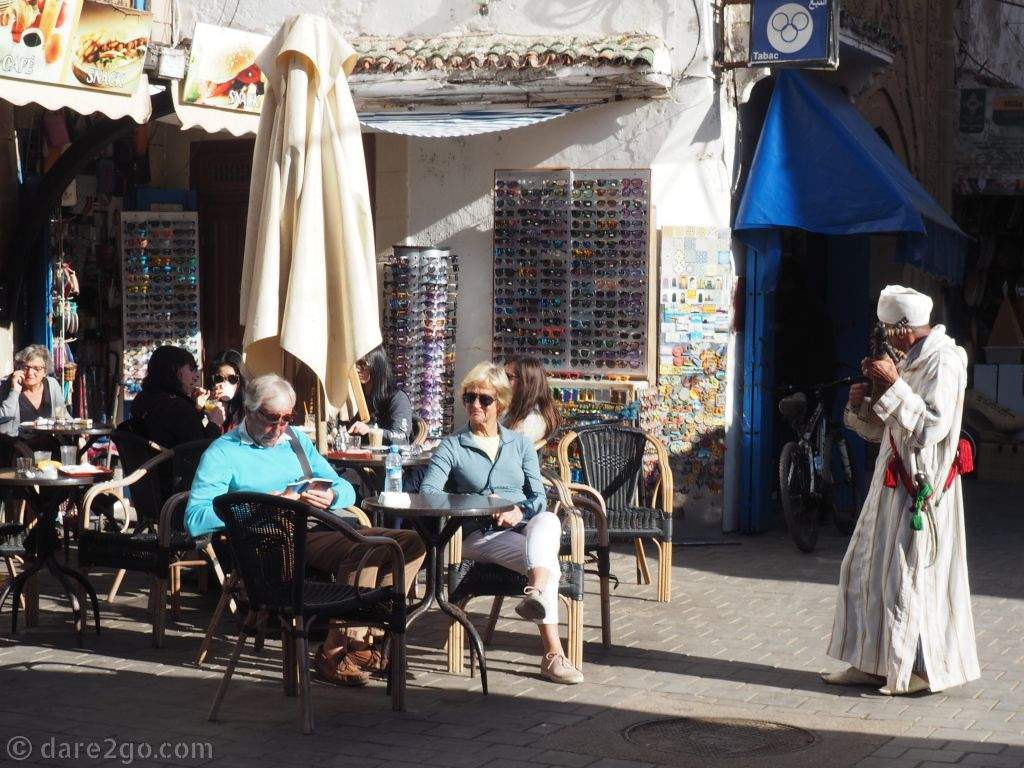A street musician playing outside a cafe in Essaouira.