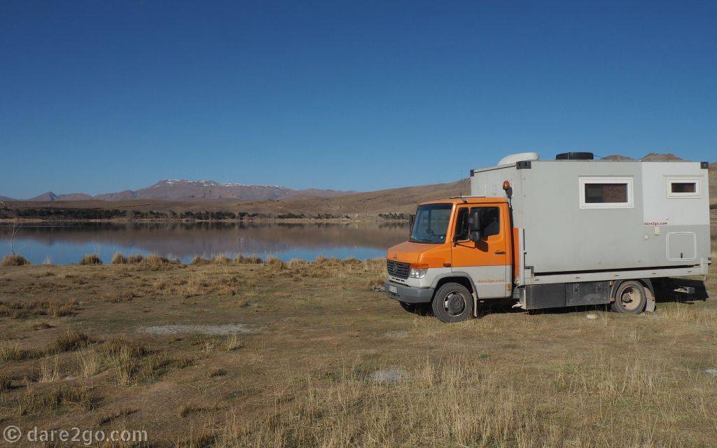 Our camper standing at the edge of a lake in the Atlas mountains - this is where we camped for the night.