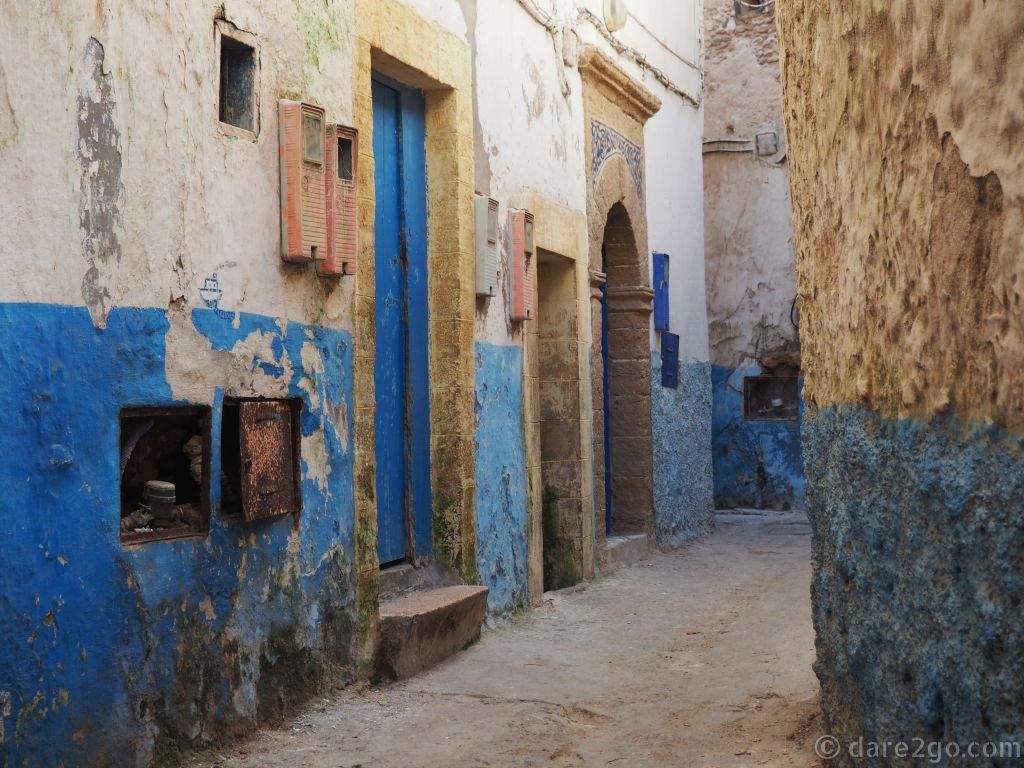 Old houses in Essaouira, the blue painted render crumbling off.