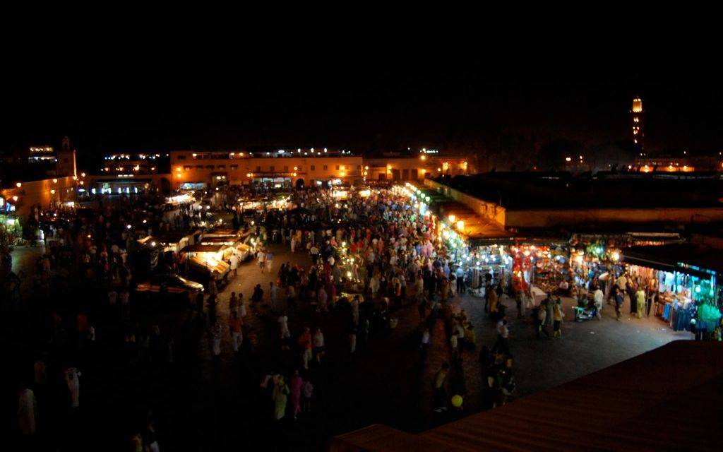 Looking down on the busy Jamaâ El Fna Square in Marrakesh at night.