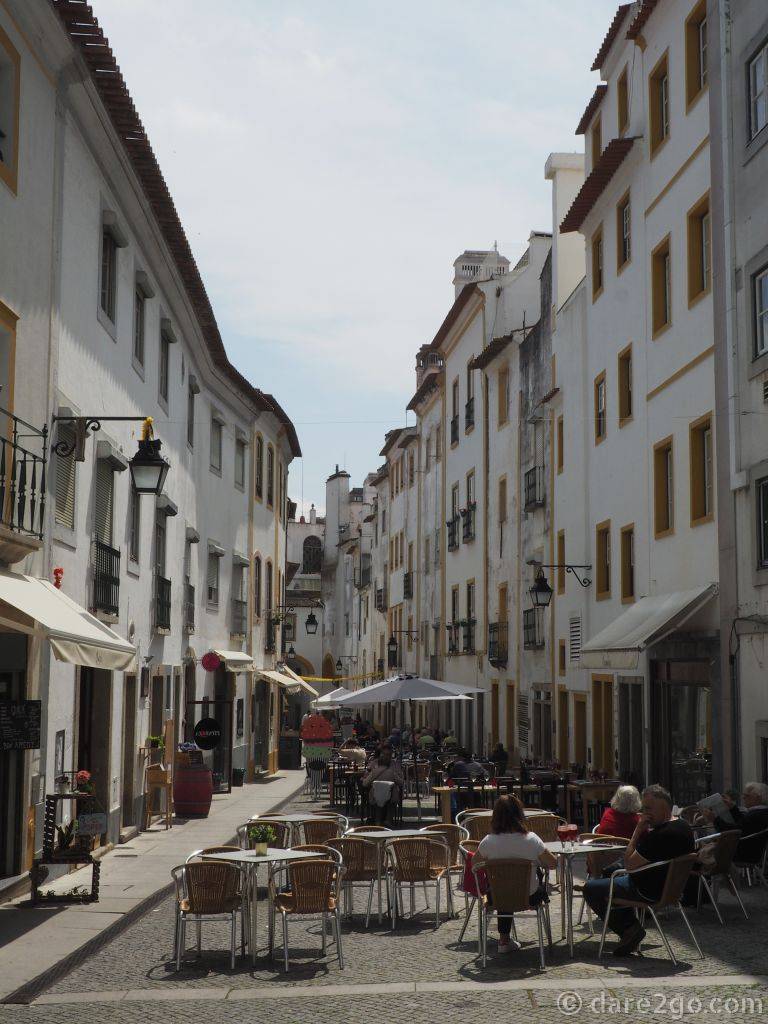 Evora side street full of outdoor restaurants