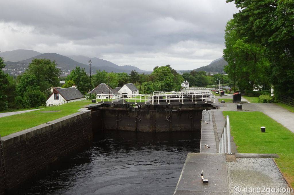 The Neptune's Staircase Locks looking from the top lock downhill. To the left are a couple of white buildings, which had previously served the canal.