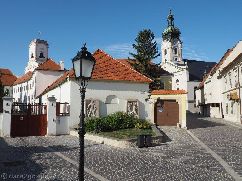 A street view of Győr's Bishop's Palace on the left, the Cathedral on the right. This part of town is usually very quiet.