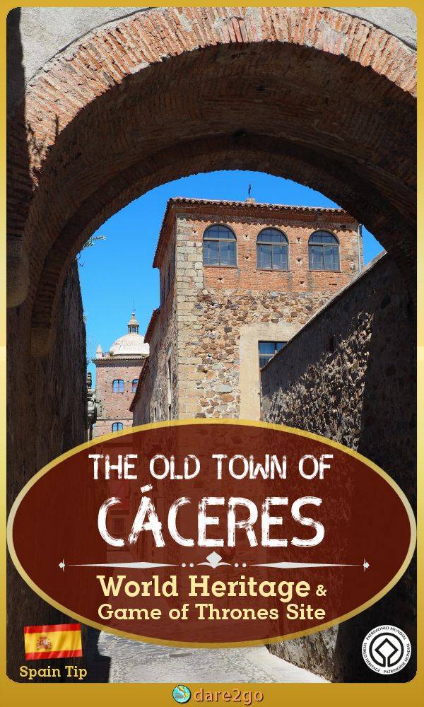 Our Pinterest image, which shows an old building in Caceres - with text overlay