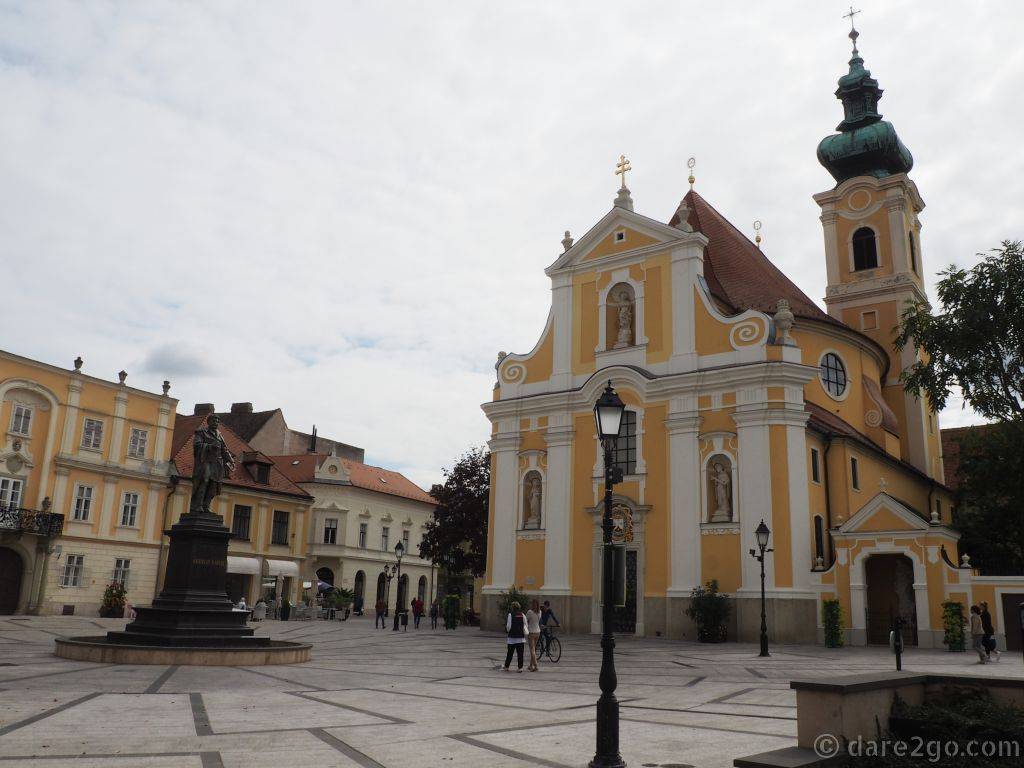 The baroque Carmelite Church in Győr. On the left you can see the statue of Kisfaludy Karoly.