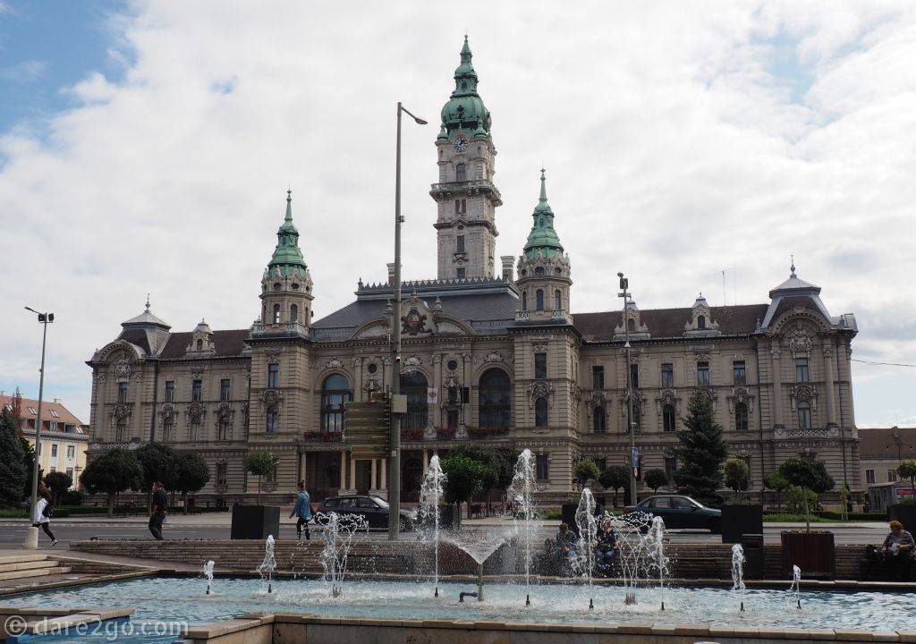 Győr's large New City Hall dominates the square at one end of the city. In the foreground another of the town's many fountains.