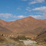 The coloured mountains are now closer, as a backdrop to Souk Khemis d’Issafen at the end of our scenic shortcut, driving from Tafraoute to Tata.