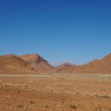 At the beginning of the R107, near El Kasba, we are following a wide, dry river bed with wide-open views to interesting geographical features.