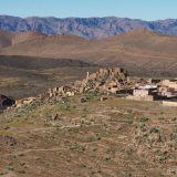 Agadir Amzouar next to the village it is named for, with a long vista of mountain ranges in the background.
