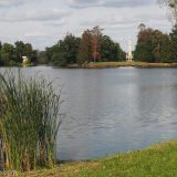 The English Park surrounding Lednice Chateau has a collection of follies. In this view across the pond, you can see the Minaret standing proud. To the left part of the Aqueduct can also be seen between the trees.