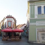 The Gate Square in Tuzla: the memorial on the green house (on the right) displays the names of the 71 victims of a single Serb rocket attack at this place. 150 more were wounded, among them many children.