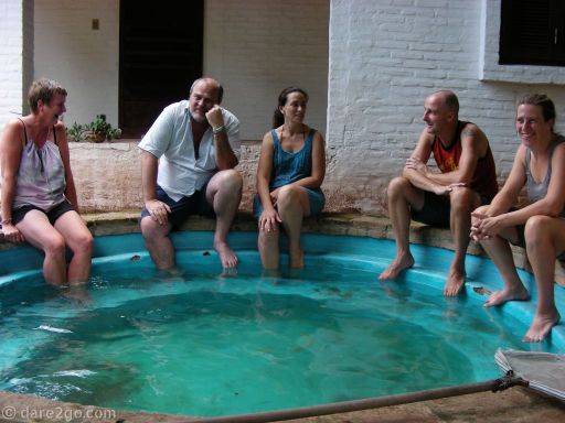 5 people sitting around a plunge pool