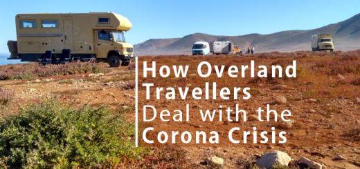 Overland travellers are different to other tourists. Here they tell their stories of how they deal with the challenges of being caught in corona lockdown. [photo shows 4 overland vehicles parked on a large rocky piece of land]