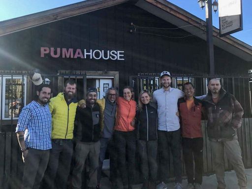 Lockdown in Puerto Natales, this is Ben's "Corona/Hostal family" - 9 people in front of the Puma House building.